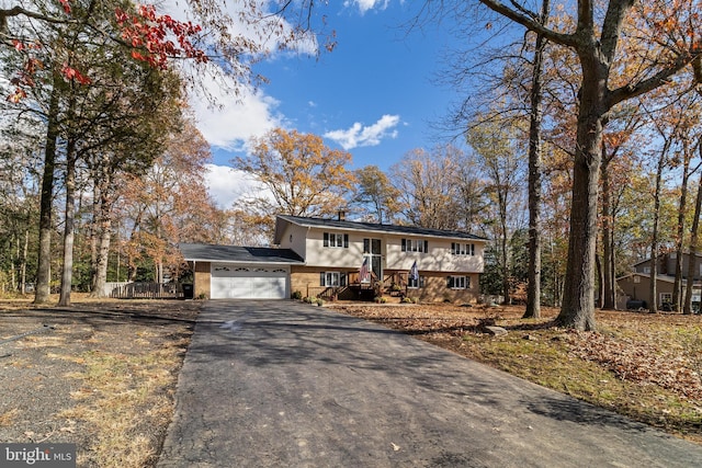 split foyer home featuring a garage