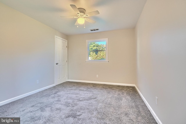 carpeted empty room with ceiling fan