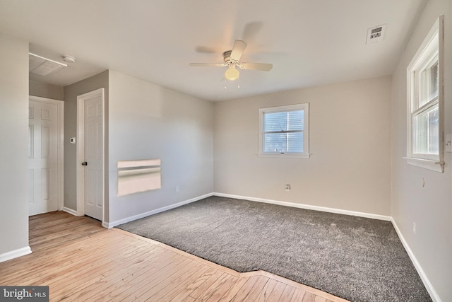 unfurnished room featuring ceiling fan and light hardwood / wood-style floors