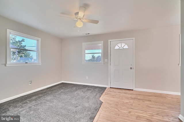 foyer featuring ceiling fan and light hardwood / wood-style flooring