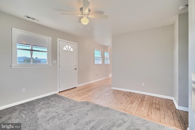 foyer with ceiling fan, hardwood / wood-style floors, and a healthy amount of sunlight