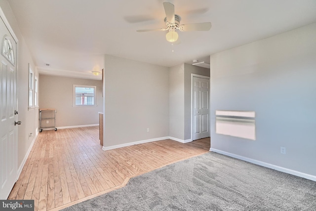 empty room featuring light wood-type flooring and ceiling fan