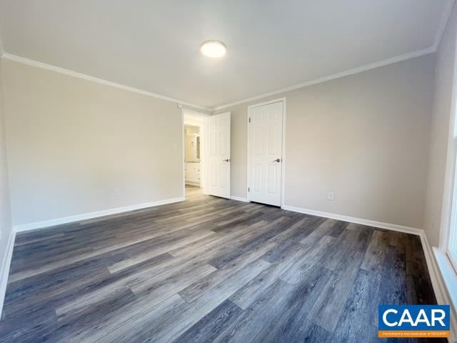 unfurnished room with dark hardwood / wood-style floors and crown molding