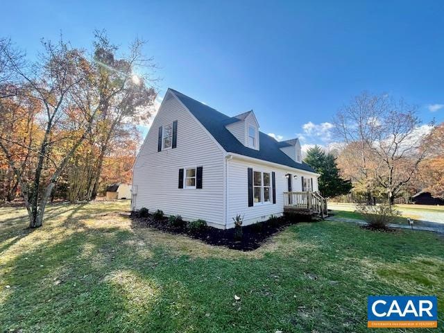 view of property exterior featuring a lawn