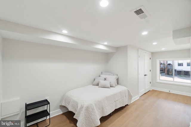 bedroom with light hardwood / wood-style floors