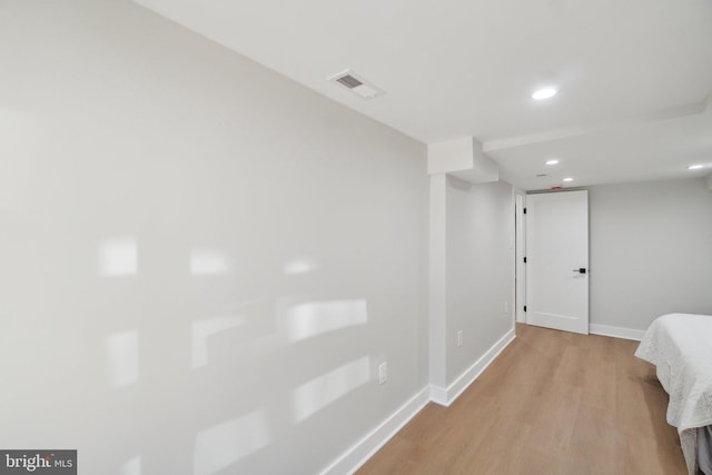 hallway with light wood-type flooring