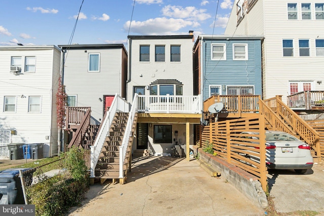 rear view of property with a wooden deck