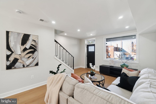 living room with light hardwood / wood-style flooring