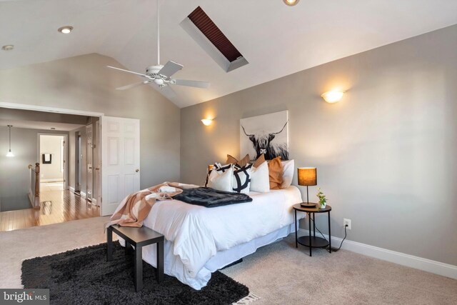 carpeted bedroom with ceiling fan and lofted ceiling