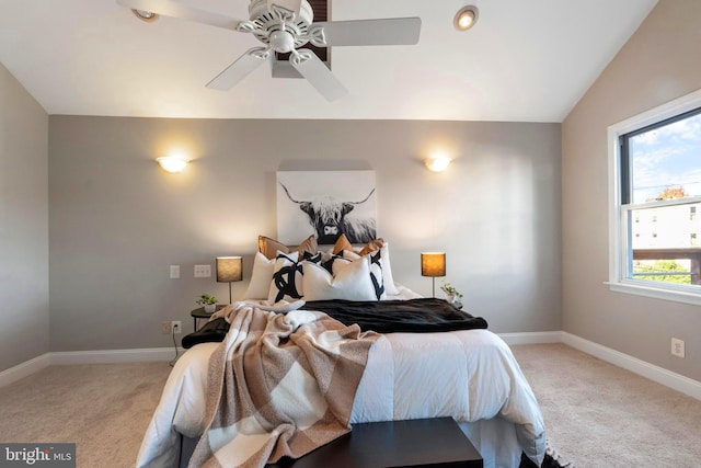 carpeted bedroom featuring ceiling fan and lofted ceiling