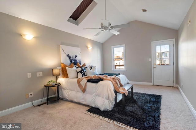 bedroom with ceiling fan, light colored carpet, and vaulted ceiling