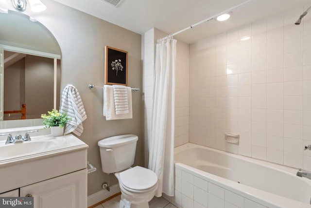 full bathroom featuring tile patterned floors, vanity, toilet, and shower / bathtub combination with curtain