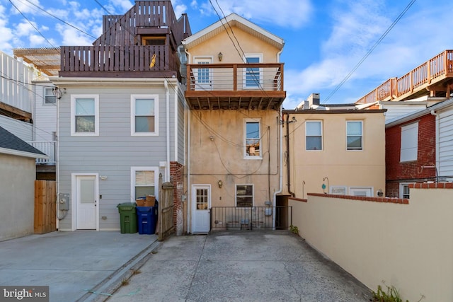 rear view of house with a balcony