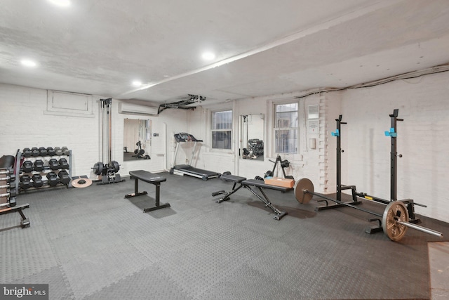 exercise room with a wall mounted AC