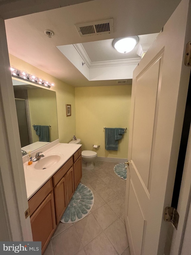 bathroom with tile patterned flooring, an enclosed shower, toilet, vanity, and ornamental molding