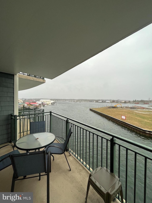 balcony featuring a water view