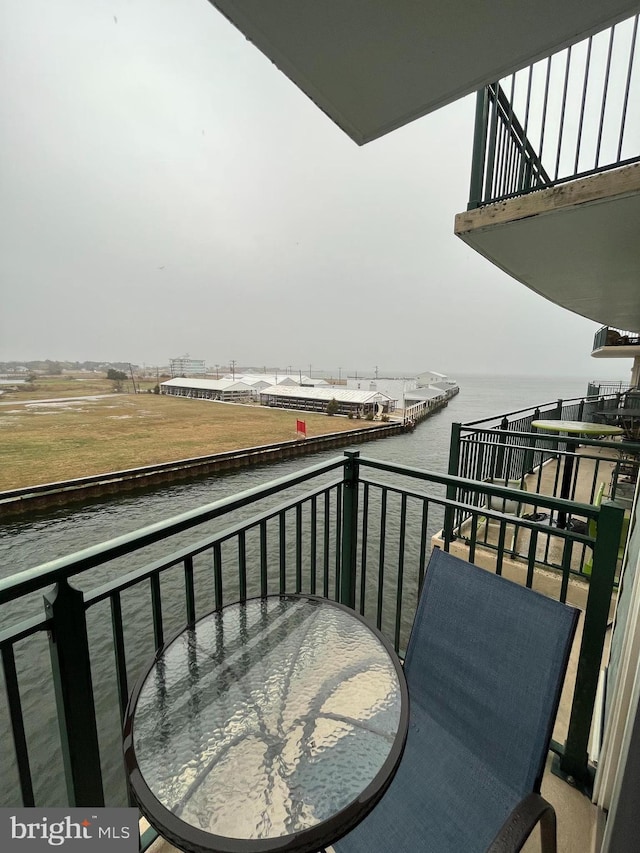 balcony featuring a water view