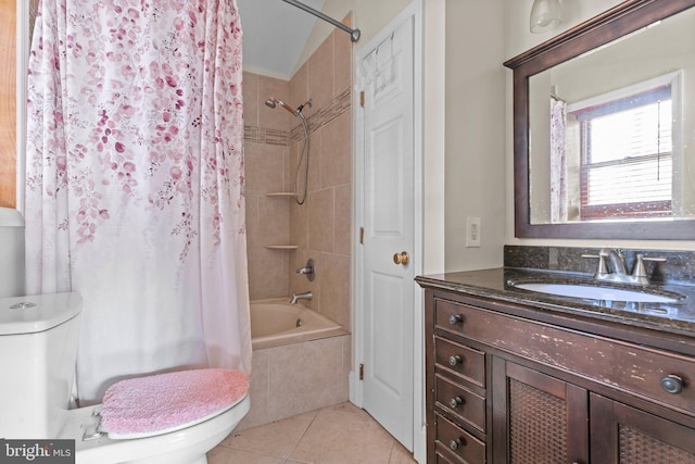 full bathroom with tile patterned flooring, shower / tub combo, vanity, and toilet