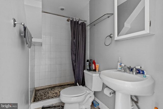 bathroom with toilet and curtained shower