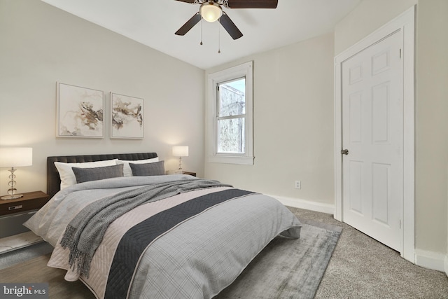 carpeted bedroom featuring ceiling fan