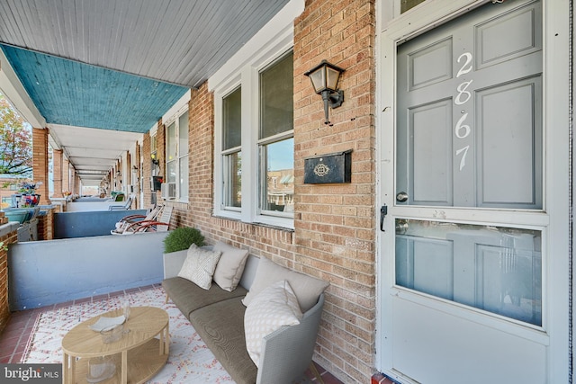 doorway to property featuring covered porch