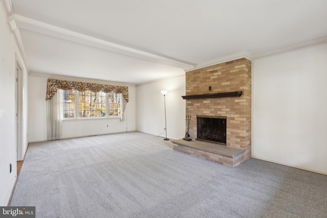 unfurnished living room with crown molding, carpet floors, and a brick fireplace