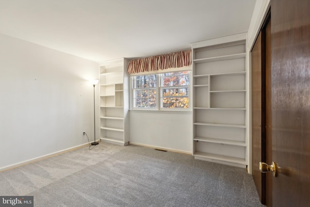 unfurnished bedroom with carpet floors and a closet