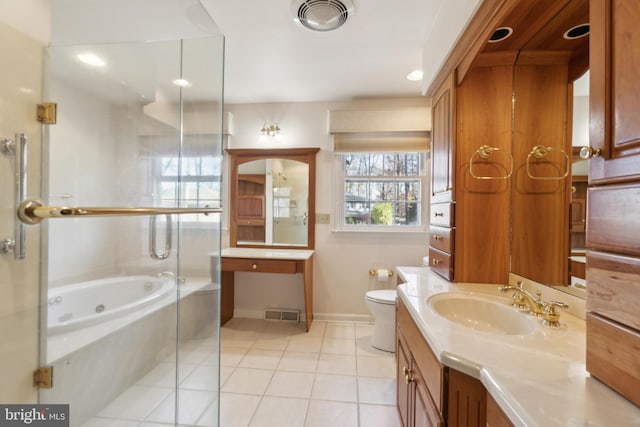 full bathroom featuring toilet, vanity, tile patterned floors, and separate shower and tub