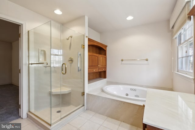 bathroom featuring separate shower and tub and tile patterned flooring