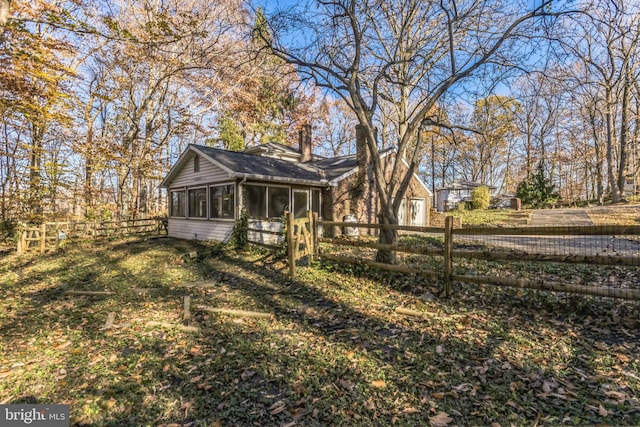 view of yard featuring a sunroom