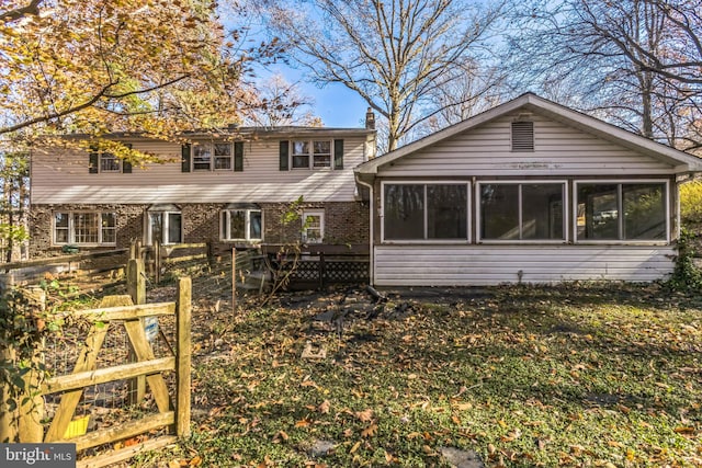 rear view of house with a sunroom