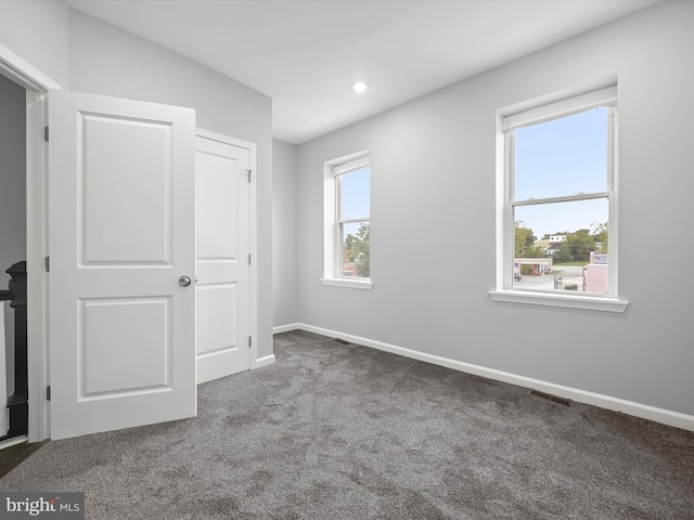 unfurnished bedroom featuring carpet