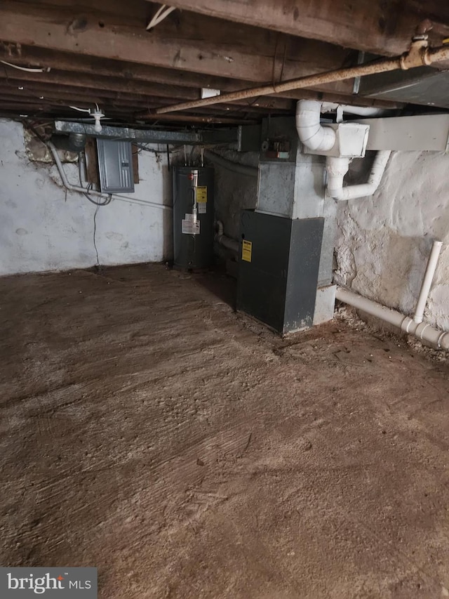 basement with electric water heater, electric panel, and heating unit