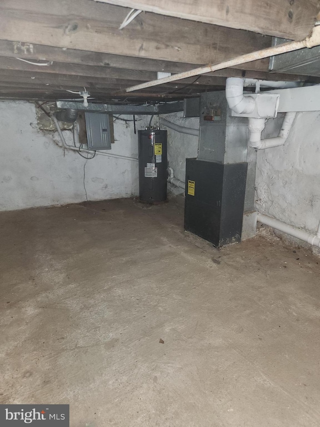 basement with electric water heater, electric panel, and heating unit