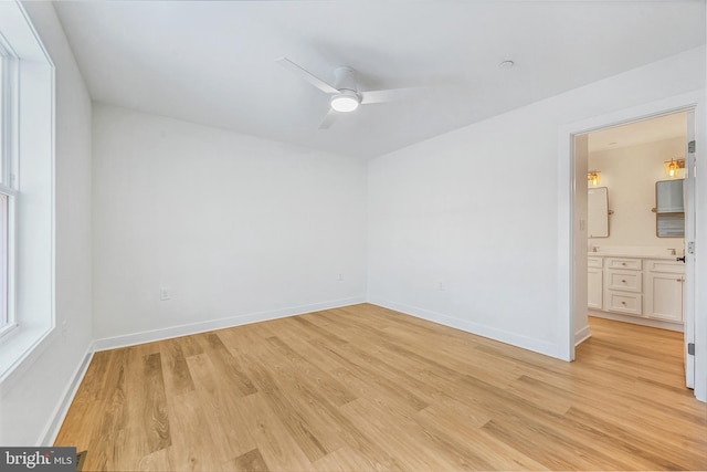 unfurnished room featuring ceiling fan and light hardwood / wood-style flooring