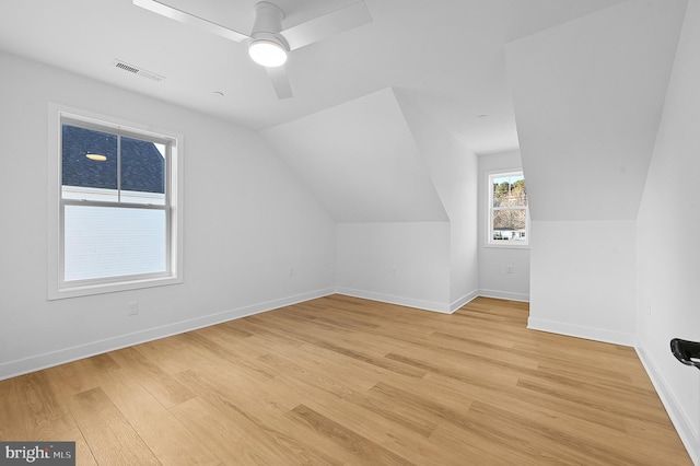 bonus room featuring light hardwood / wood-style floors, ceiling fan, and vaulted ceiling