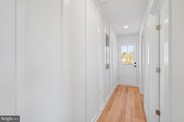 corridor with light hardwood / wood-style flooring