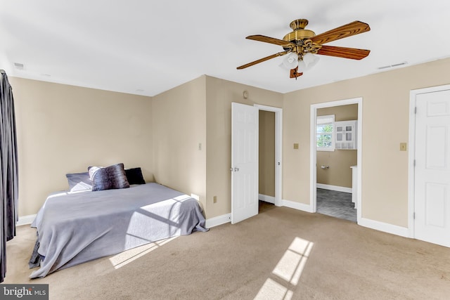 bedroom featuring ceiling fan and light carpet