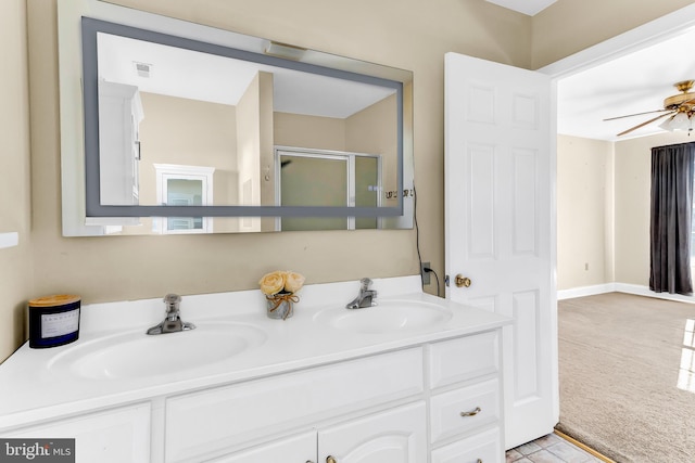 bathroom with an enclosed shower, vanity, and ceiling fan