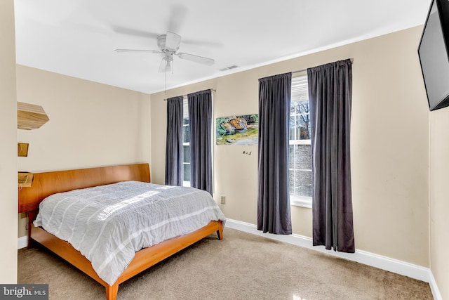 bedroom featuring ceiling fan and light colored carpet