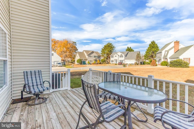 wooden deck with a yard