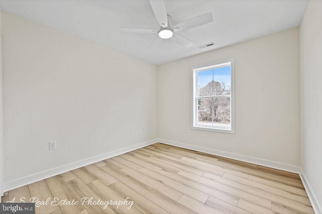 spare room featuring ceiling fan and light hardwood / wood-style flooring