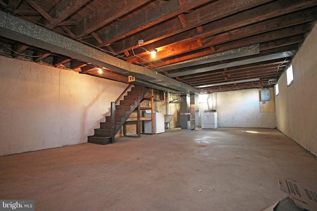 basement featuring washer / clothes dryer and heating unit