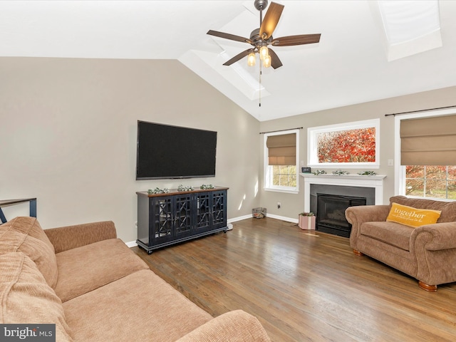 living room featuring wood-type flooring, ceiling fan, and lofted ceiling