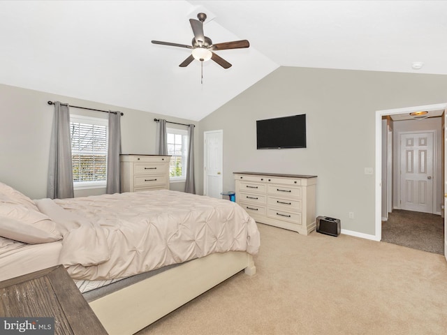 bedroom featuring ceiling fan, light carpet, and lofted ceiling