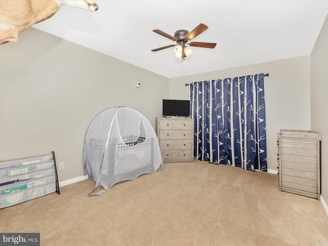 carpeted bedroom featuring ceiling fan