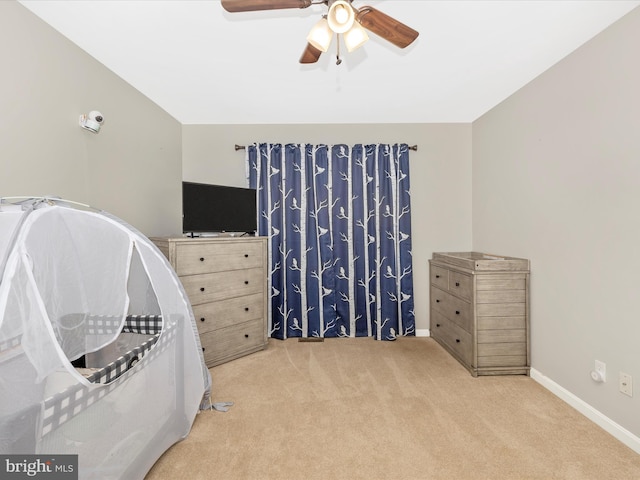 carpeted bedroom with ceiling fan