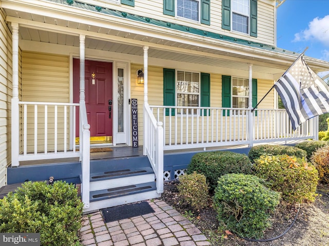 doorway to property featuring a porch