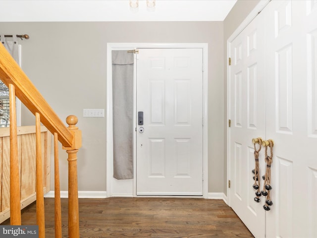 entryway with dark hardwood / wood-style floors