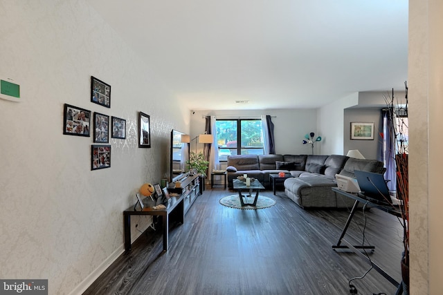 living room with dark hardwood / wood-style flooring